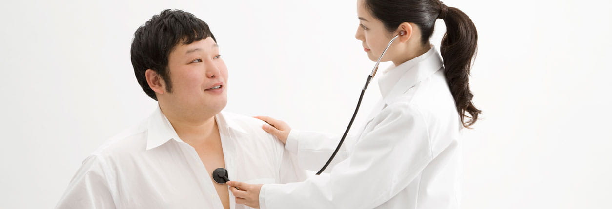 A doctor specializing in weight loss management meets with a patient at Baptist Memorial Hospital