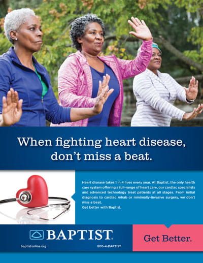 Three middle-aged women exercise outdoors, raising hands in coordinated motion during a park-based group fitness session.