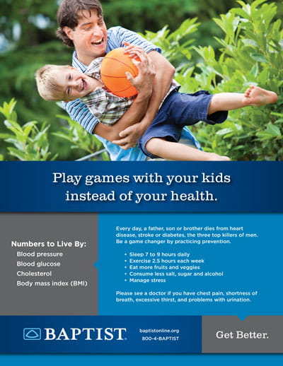 Father lifts laughing young child holding an orange ball in a leafy backyard, playful moment promoting family health.