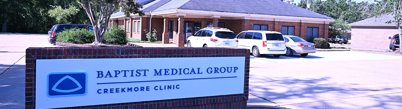 Baptist Medical Group Creekmore Clinic entrance and parking.